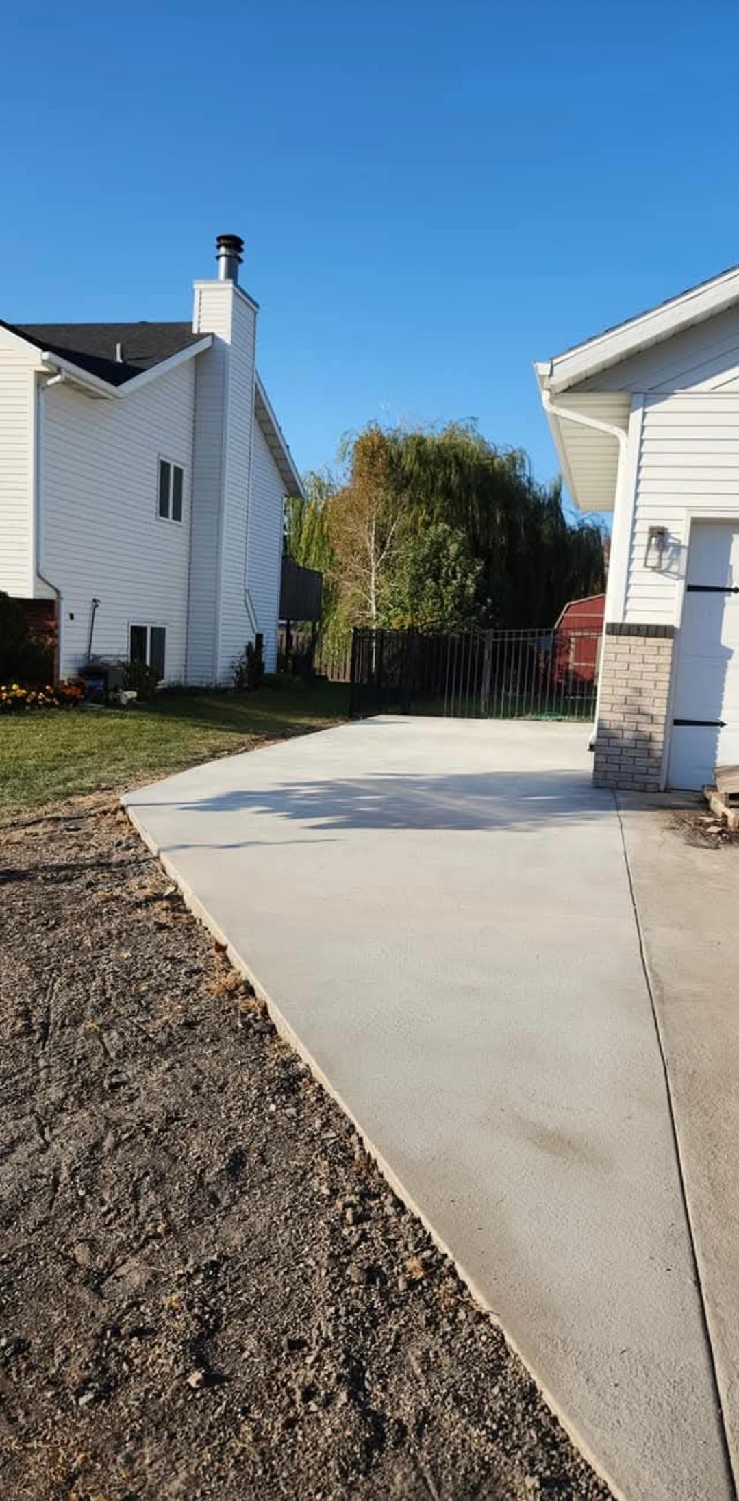 Finished concrete driveway between two homes