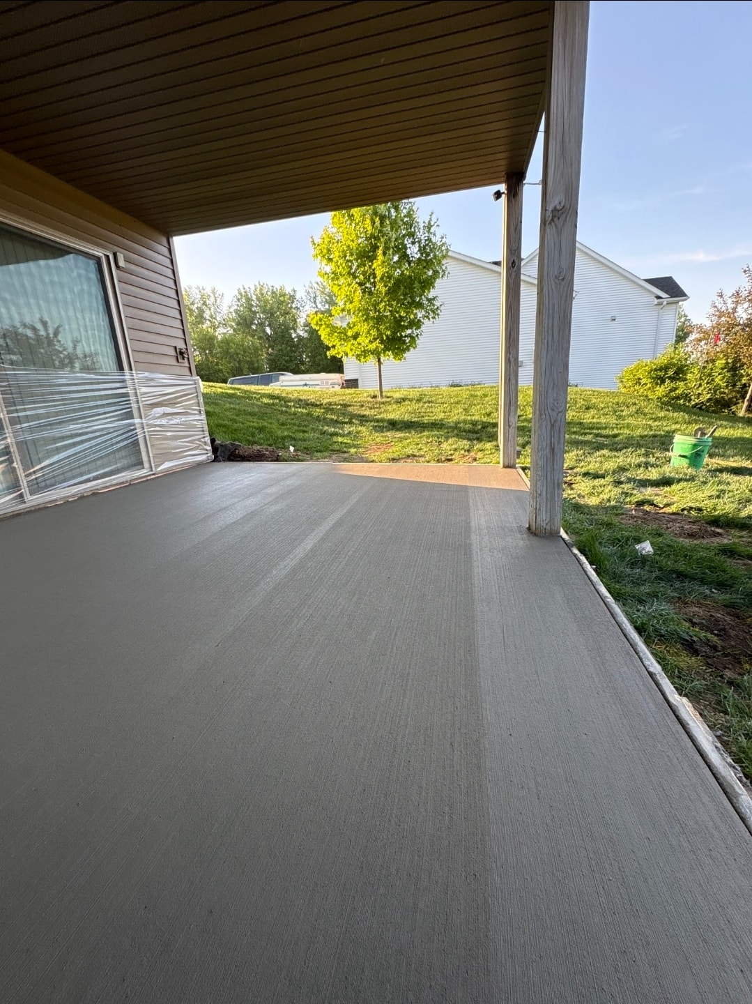 Finished concrete side pad next to garage